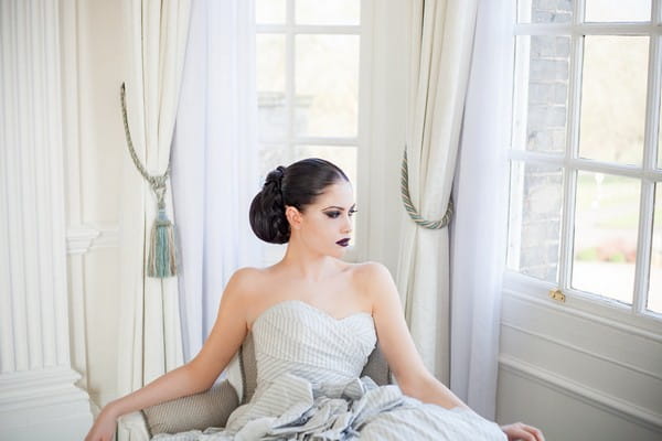 Bride with chignon sitting in chair