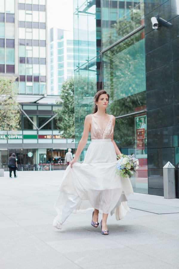 Bride walking through streets