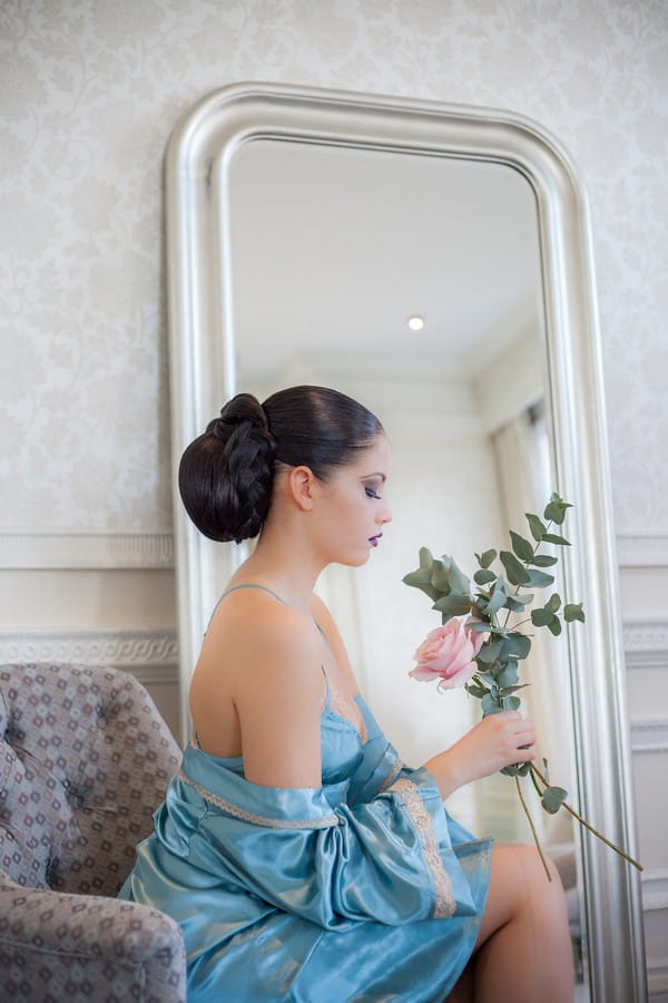 Bride sitting wearing blue dress