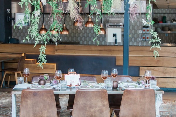 Wedding table with foliage hanging above