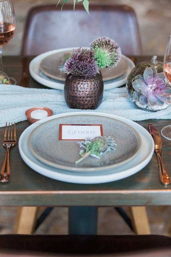 Copper and botanical wedding place styling