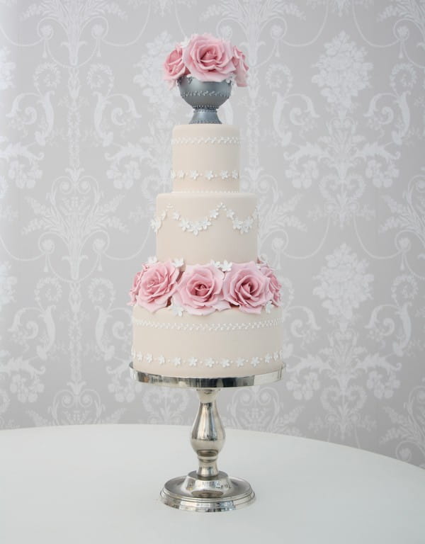 Light Beige Coloured Wedding Cake with White Piping and Flowers