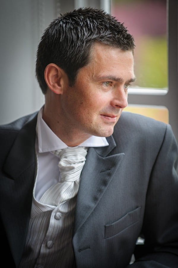 Groom Wearing White and Silver Striped Waistcoat and Cravat