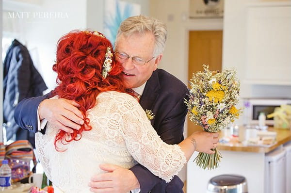 Bride hugging father