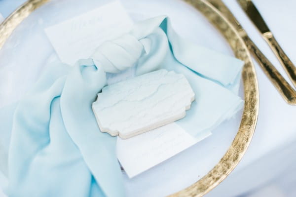 Plate and blue napkin at wedding place setting