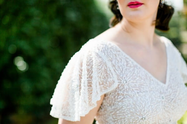 Butterfly sleeves on bride's 1920s style wedding dress