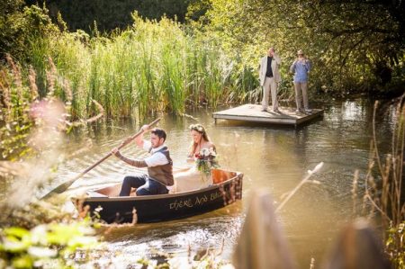 Bride and groom in rowing boat - Picture by Special Day Wedding Photos