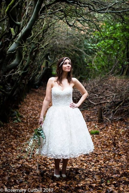 Bride standing in woodland with hand on hip - Picture by Rosie Cutbill Photography