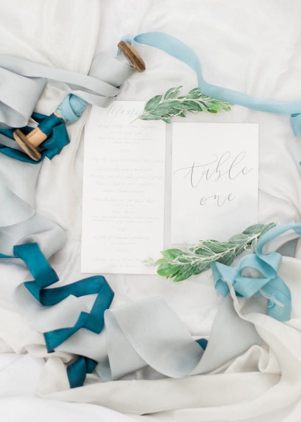 Wedding stationery and blue ribbons