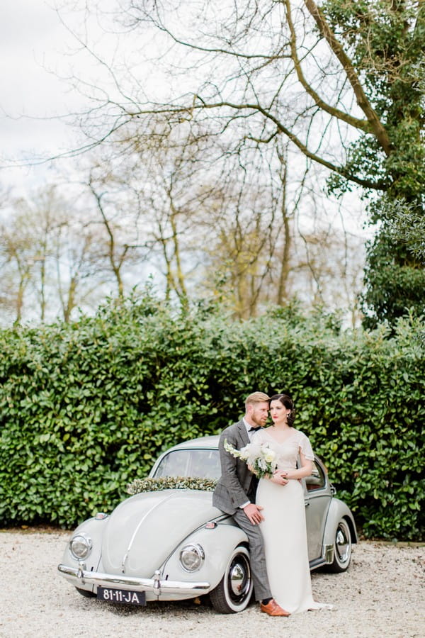 Bride and groom with VW Beetle