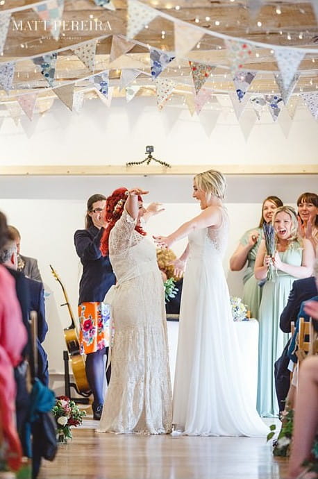 Happy brides about to kiss