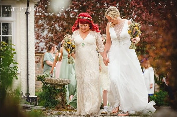 Brides holding hands