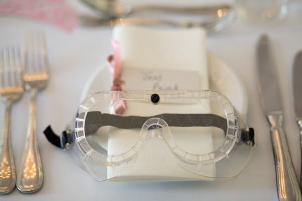 Goggles at wedding place setting