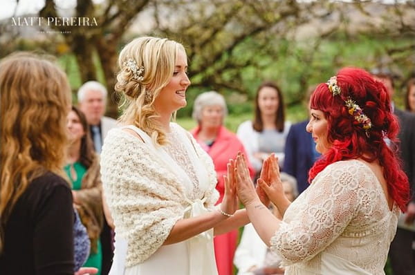 Bride's holding hands up against each other