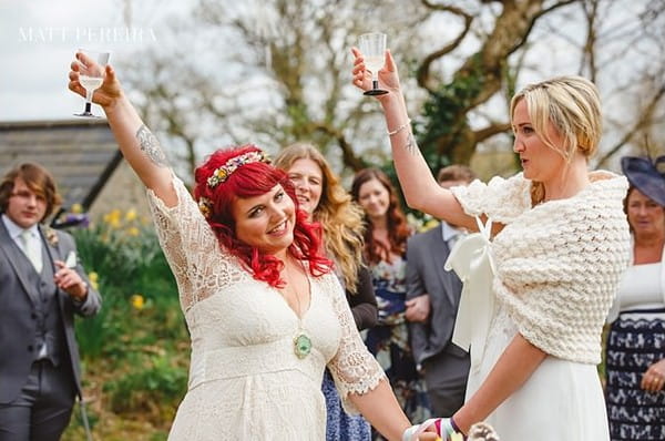 Brides raising glasses