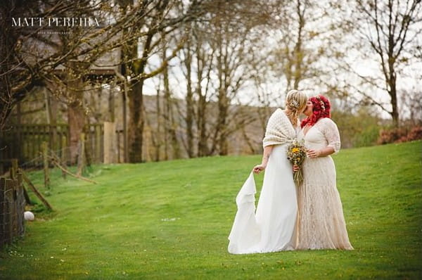 Brides kissing in grounds of The Green Cornwall