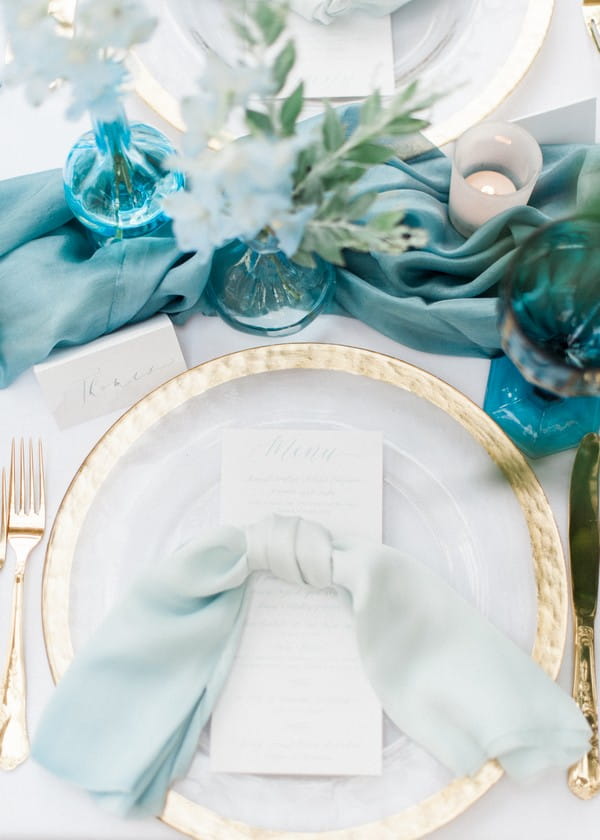 Gold rimmed plate on wedding table