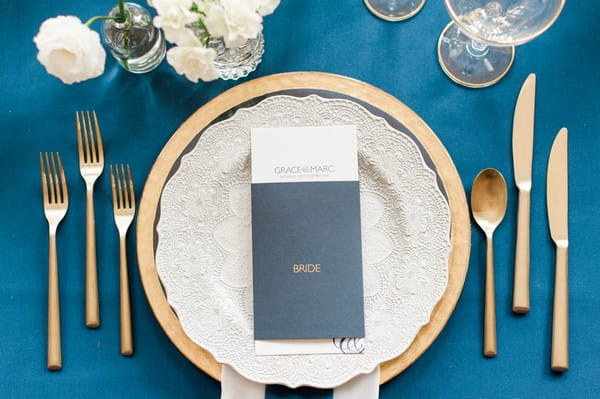 Wedding place setting with navy blue menu