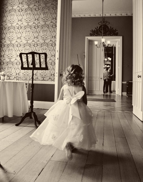 Child Running Through Wedding Venue