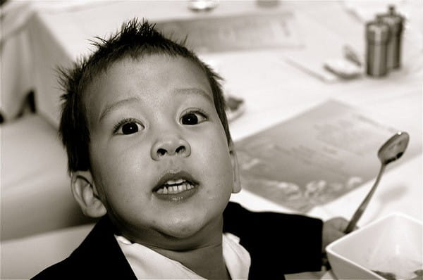 Child Sitting at Wedding Table