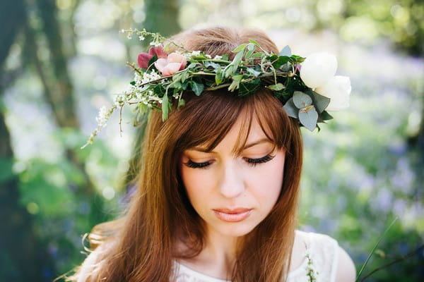 Bride with foliage crown looking down