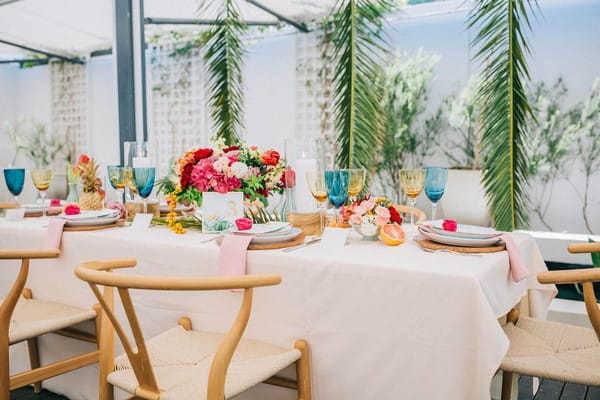 Bright, colourful tropical styled wedding table