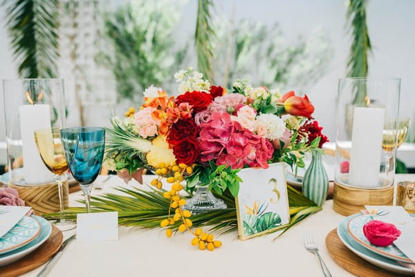 Bright and colourful wedding table flowers