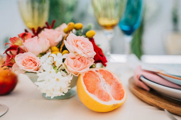 Wedding table flowers and pink grapefruit