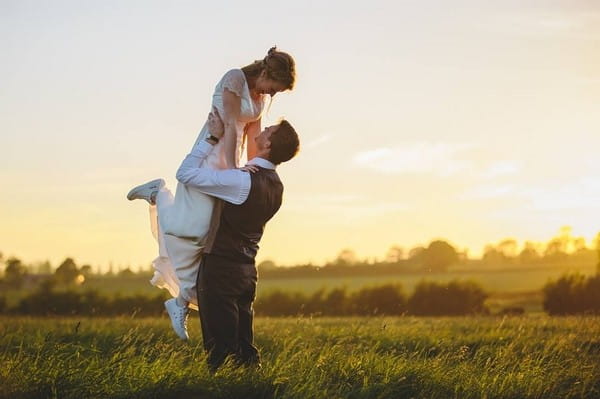 Groom lifting bride into the air - Picture by Mark Leonard Photography