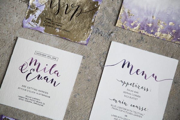 Gold and purple wedding stationery