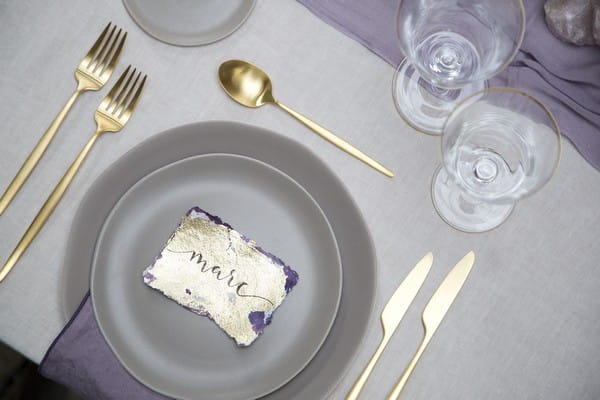 Wedding place setting with gold cutlery