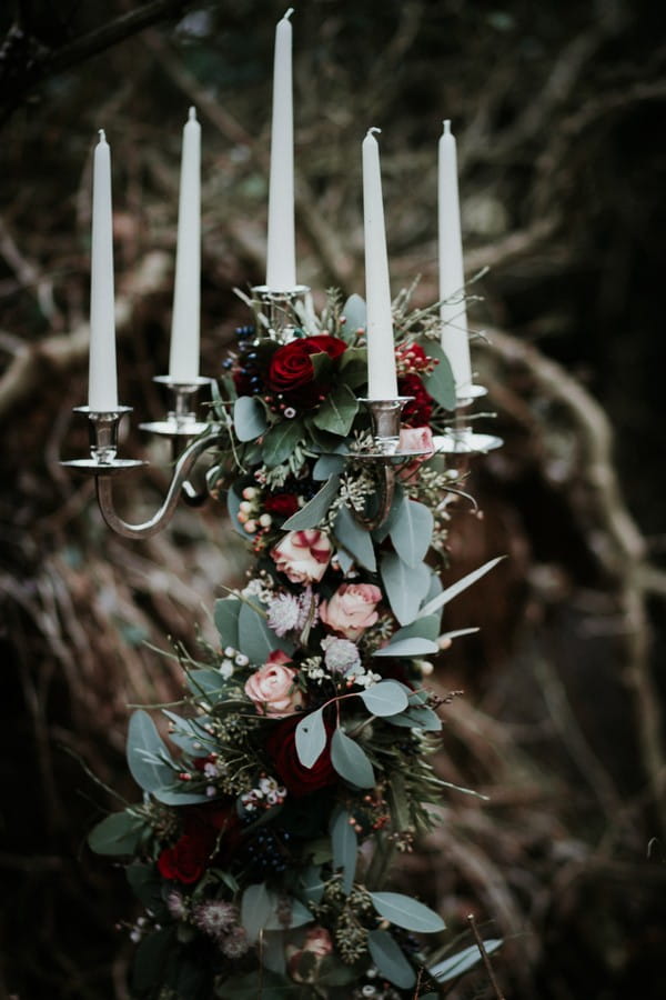 Candelabra covered in foliage