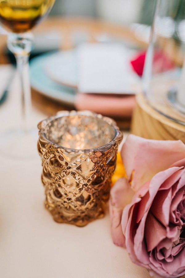 Gold votive on wedding table