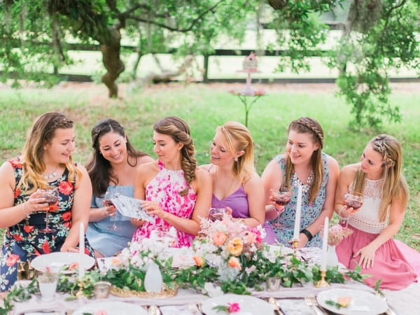 Girls sitting at picnic table for hen party