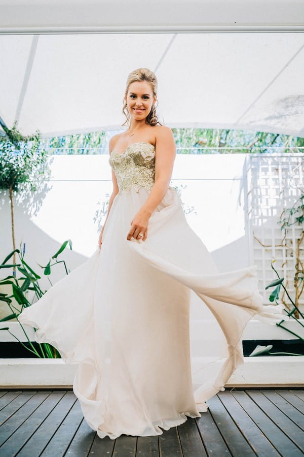 Bride twirling in wedding gown