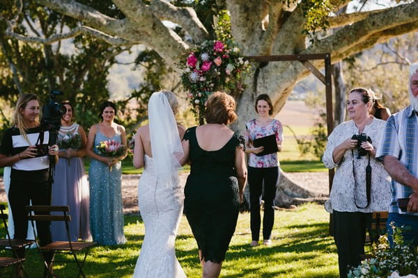 Mother walking bride down the aisle at Yandina Station wedding