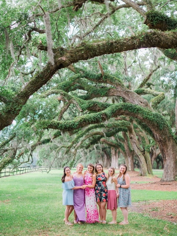 Girls standing under tree