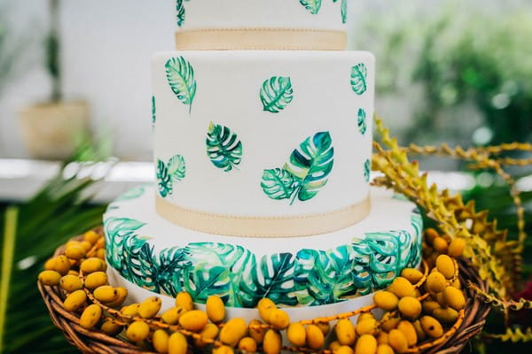 Palm leaves detail on tropical wedding cake