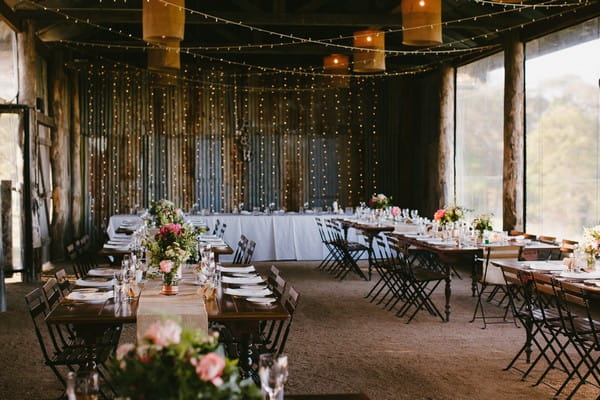 Tables in Yandina Station Dairy Barn for wedding reception