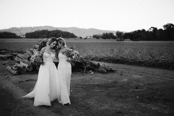 Two brides walking together