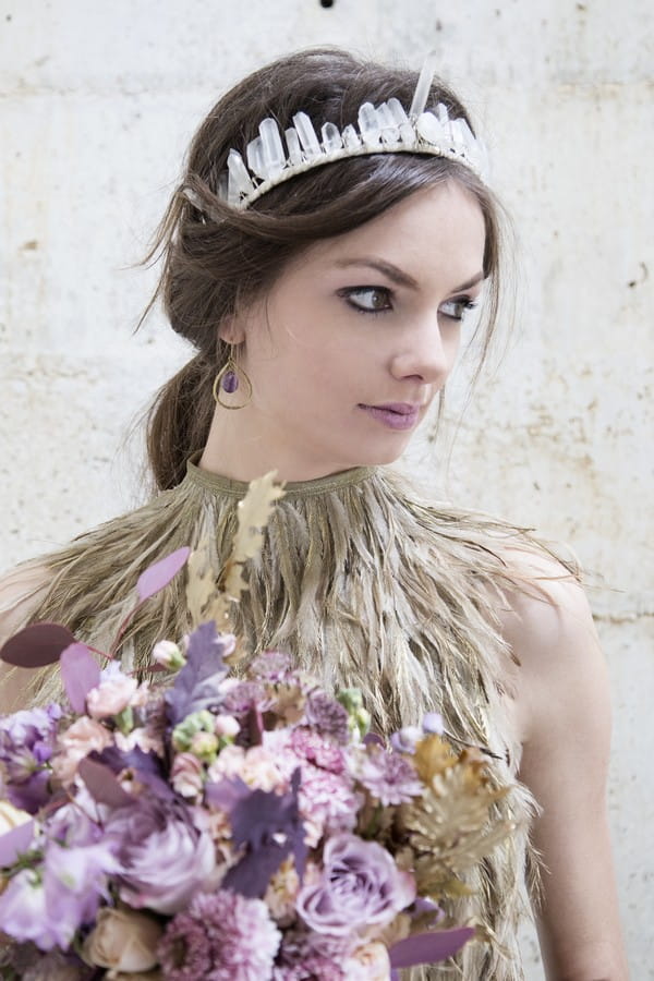 Bride wearing feather collar bridal neckpiece and feather crown