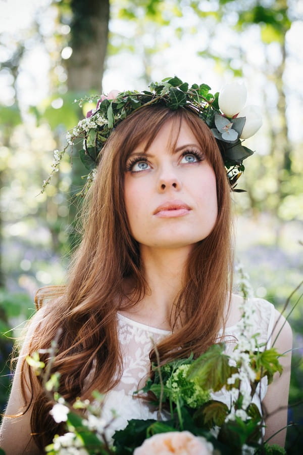Bride with foliage crown looking up