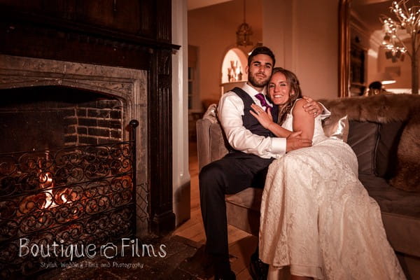 Bride and Groom Sitting Next to That Amazing Place Fireplace