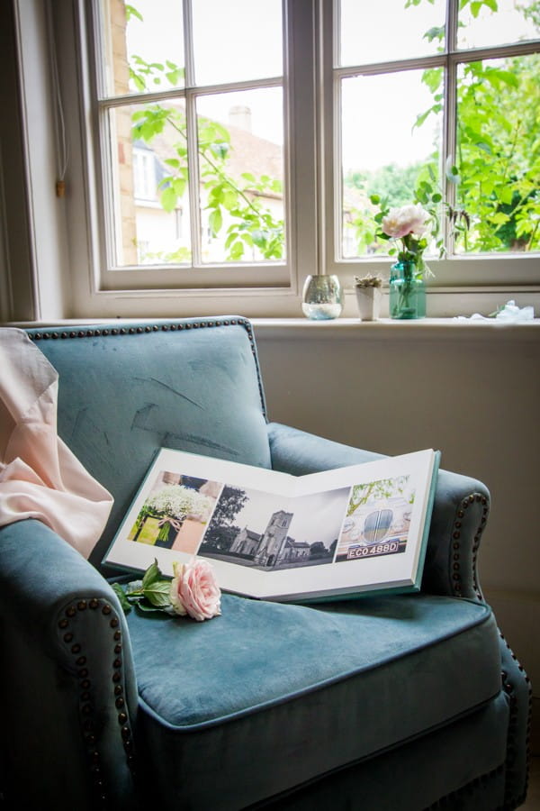 Wedding Photo Album Open on Chair Showing Pictures Inside