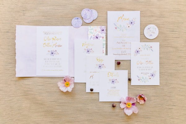 Violet and gold wedding stationery