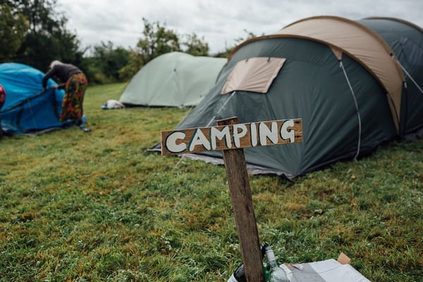 Camping sign at festival wedding