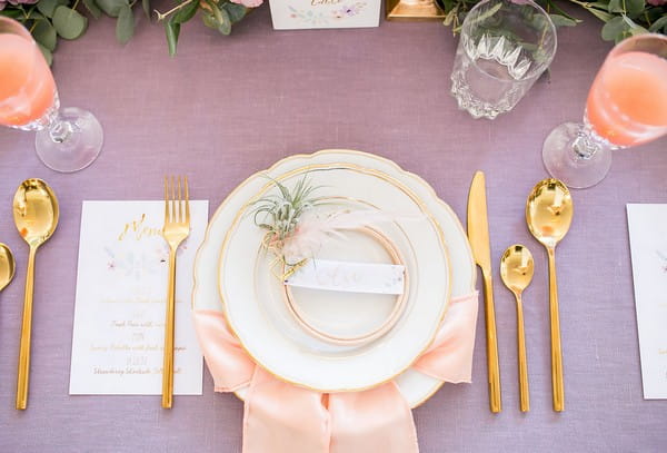 Wedding place setting with light peach napkin