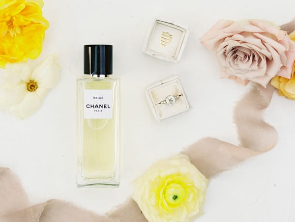 Chanel perfume, wedding ring and flowers