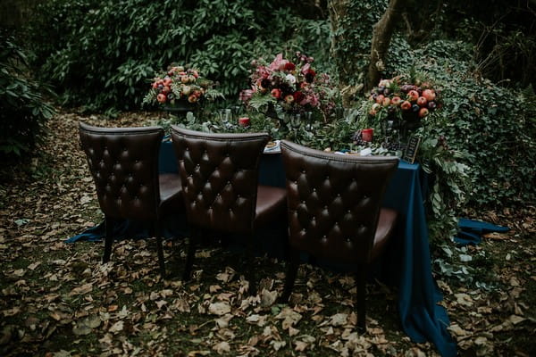 Leather chairs at wedding table