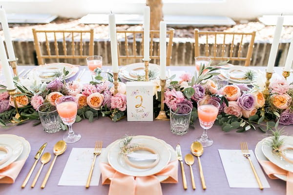 Violet and peach wedding table styling